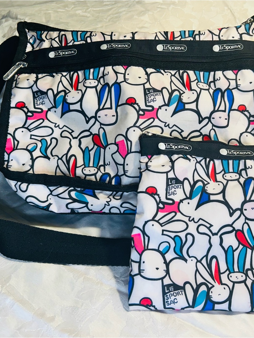 LeSportsac Playful Bunnies Deluxe Crossbody Bag with zip-up bag